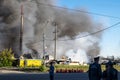 Explosion and fire at a gas station. Gas cylinders are placed on the road to avoid additional explosions