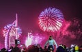 Explosion of multi-colored fireworks at Burj Al Arab Jumeirah Dubai against the night sky on a new year c