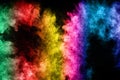 The explosion of multi colored powder. Beautiful rainbow color powder fly away. Royalty Free Stock Photo