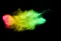 The explosion of multi colored powder. Beautiful rainbow color powder fly away. Royalty Free Stock Photo