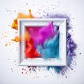 Explosion of multicolored particles of powder at the Holi party with a photo frame on a white background. Royalty Free Stock Photo