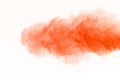 The explosion of orange powder. Freeze motion of color powder exp