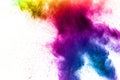 Explosion of rainbow color powder on white background. Royalty Free Stock Photo