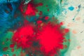 Explosive emotional drops of red, green, blue on white paper Royalty Free Stock Photo