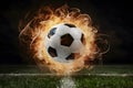 Explosive energy captured in a fiery soccer ball moment