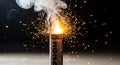 Explosive sparkler firework detonating with intense bright orange flames and flying embers up close dynamic shot Royalty Free Stock Photo