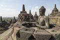 Exposed Buddha, Dharmachakra mudra, on top of the Borobudur temple