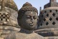 Exposed Buddha, reaching Nirvana, on top of the Borobudur temple