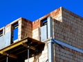 exposed concrete and block wall structure. building frame at construction stage with scaffolding Royalty Free Stock Photo