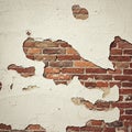 Exposed red brick wall with large sections of peeling beige stucco. The bricks are Royalty Free Stock Photo