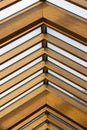 Exposed wooden truss rafters supporting glass skylight roof Royalty Free Stock Photo