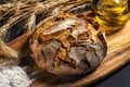 Exposition of fresh home made bread on wooden table, tasty breakfast. Bread with olive oil. Royalty Free Stock Photo