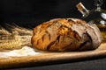 Exposition of fresh home made bread on wooden table, tasty breakfast. Bread with olive oil. Royalty Free Stock Photo