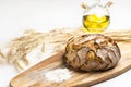 Exposition of fresh home made bread on wooden table, tasty breakfast. Bread with olive oil. Royalty Free Stock Photo