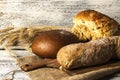 Exposition of fresh home made bread on wooden table, tasty breakfast. Bread with olive oil. Royalty Free Stock Photo