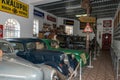 Exposition of historical sedans and vans with mannequins in period suits