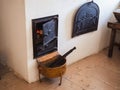 Exposition in the museum of the Cossacks: fireplace - stove with burning logs