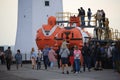 Exposition visitors near the old deep-submergence rescue vehicles AS-5 and AS-22 in evening