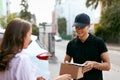 Express Delivery Service. Courier Delivering Package To Woman Royalty Free Stock Photo
