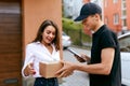 Express Delivery Service. Courier Delivering Package To Woman Royalty Free Stock Photo