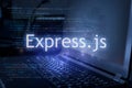 Express.js inscription against laptop and code background. Learn express JavaScript programming language  computer courses Royalty Free Stock Photo