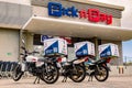 Express Service home delivery bikes parked outside local Pick n Pay grocery store