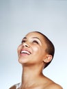 Expressing the truest form of myself. Studio shot of a beautiful young woman smiling against a grey background.