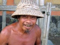 EXPRESSION OF A BALINESE MAN IN A VILLAGE