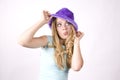 Expression girl thinking with purple hat Royalty Free Stock Photo