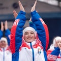 Expression performance of pretty girls of dance group in clothes with symbols of Russia