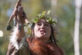 Expression young woman in clothing aborigine of Kamchatka Peninsula