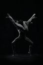 Expressive, artistic man and woman , ballet dancers making sensual, passionate performance, dancing. Black and white