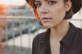 Expressive attentive look girl teenager in black hat.