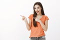 Expressive charming woman discussing new nail salon with girlfriends. Portrait of amazed excited european woman