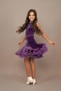 expressive child with long curly hair dancing in ballroom dress full length, dancer