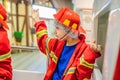 Expressive cute toddler with fireman`s outfit playing fireman Royalty Free Stock Photo