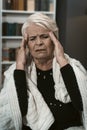 Expressive Elderly Blonde Feels A Headache From Stress Royalty Free Stock Photo