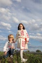 Expressive full-length portrait of Ukrainian children, a boy and a girl of 6-7 years old