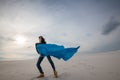 Expressive girl, in a flying blue scarf Royalty Free Stock Photo