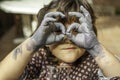 Expressive girl portrait acting with painted hands