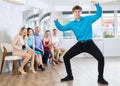 Expressive guy demonstrating krump dance moves in choreographic studio Royalty Free Stock Photo