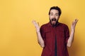 Expressive Happy Young Bearded Man Hands up Royalty Free Stock Photo