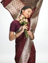 Expressive indian woman with pink roses Royalty Free Stock Photo