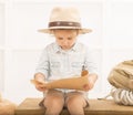 Expressive little girl reading tresure map