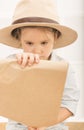 Expressive little girl reading tresure map