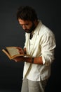 Expressive man reading a book Royalty Free Stock Photo
