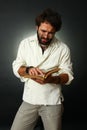Expressive man reading a book Royalty Free Stock Photo