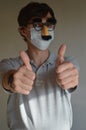 Man wearing face mask and Groucho glasses