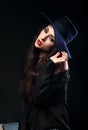 Expressive female model posing in black shirt and elegant h Royalty Free Stock Photo