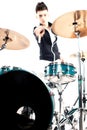 Expressive young drummer playing at the drums with drum stick Royalty Free Stock Photo